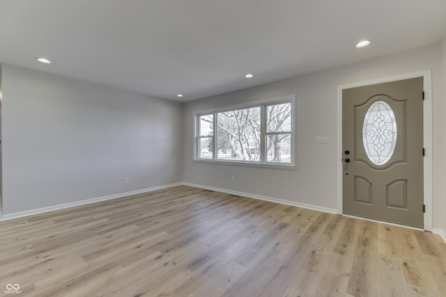 foyer with light hardwood / wood-style floors