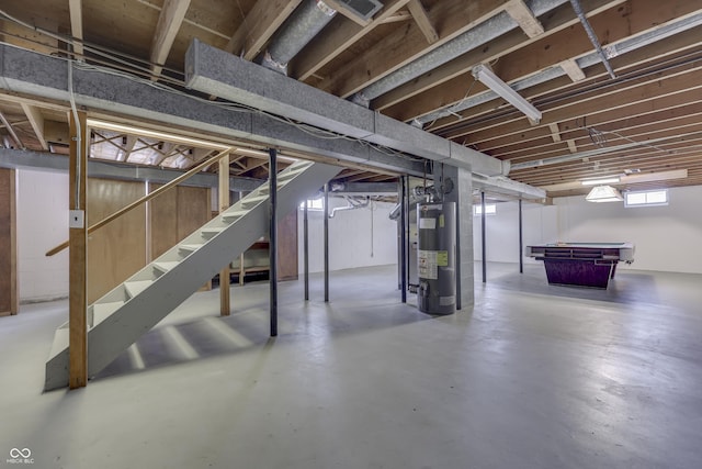 basement with pool table and gas water heater