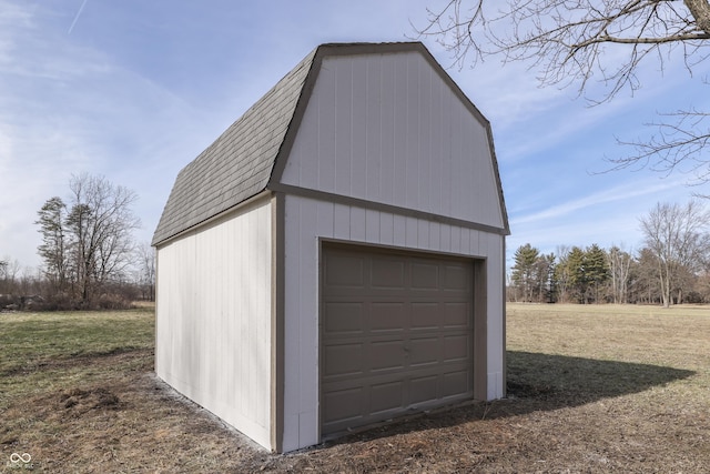 garage featuring a lawn