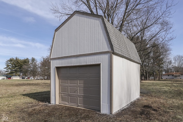 garage featuring a lawn