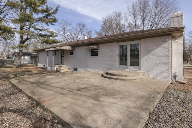 rear view of property featuring a patio