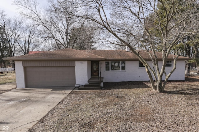 ranch-style home featuring a garage