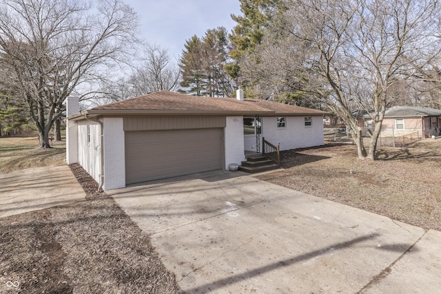 single story home with a garage