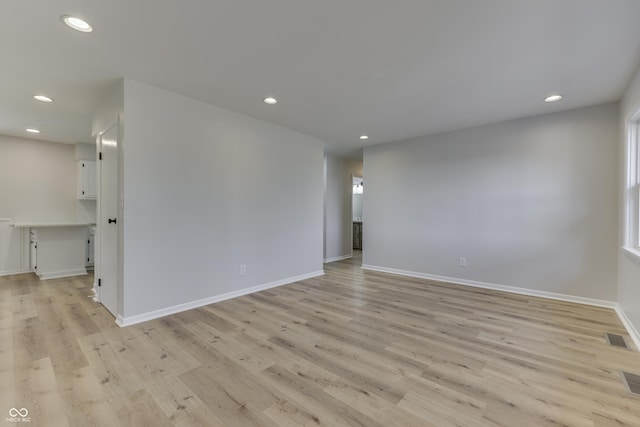 unfurnished room with light hardwood / wood-style floors