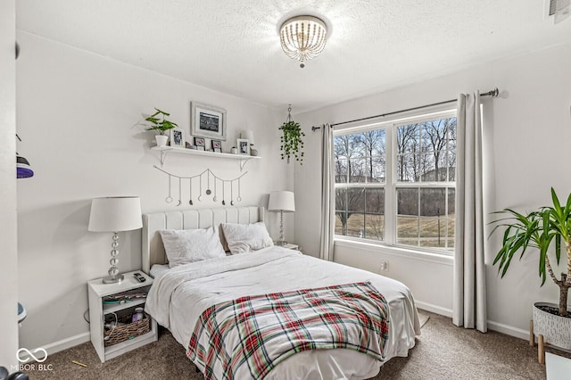 carpeted bedroom featuring a textured ceiling