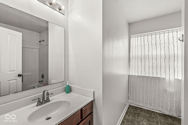 bathroom with vanity, tub / shower combination, and a textured ceiling