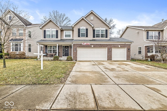 front of property with a garage, a front lawn, and a porch