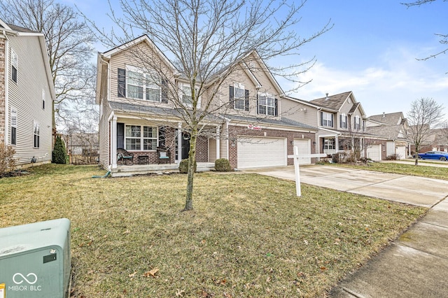 view of front of home featuring a garage, a front lawn, and a porch