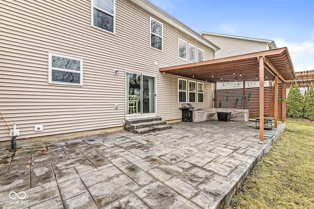 view of patio featuring a grill and a pergola