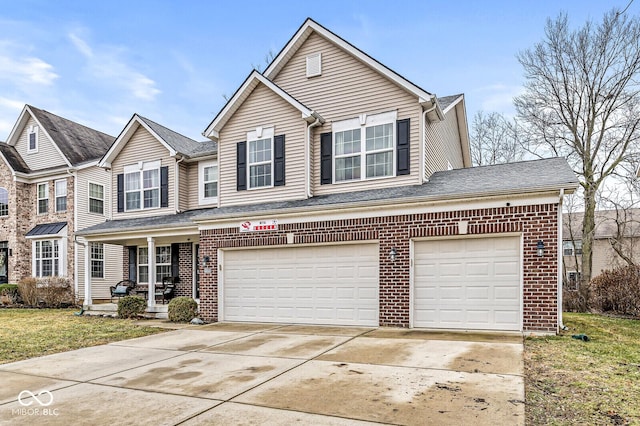 front facade with a garage, covered porch, and a front yard