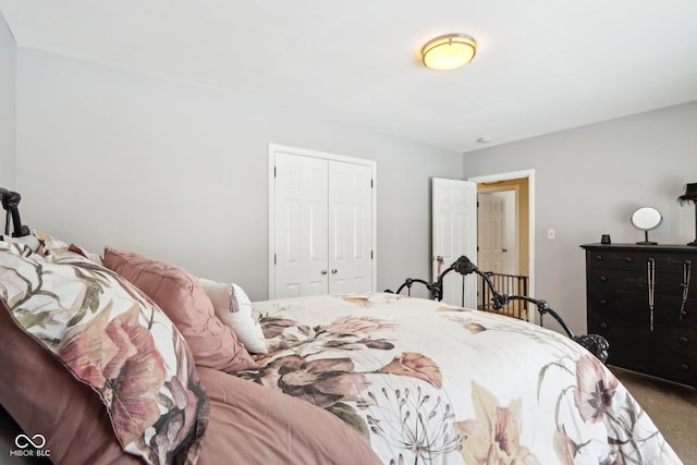 carpeted bedroom with a closet