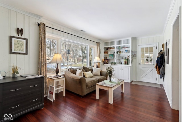 living area featuring dark hardwood / wood-style flooring and crown molding