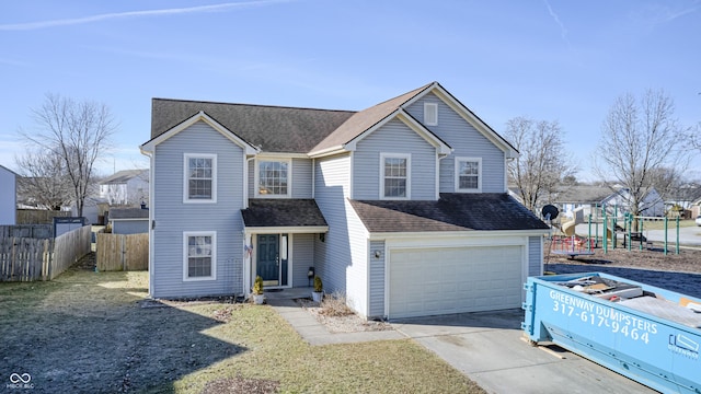 front of property featuring a garage and a playground