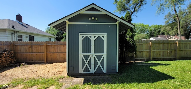 view of outbuilding with a lawn