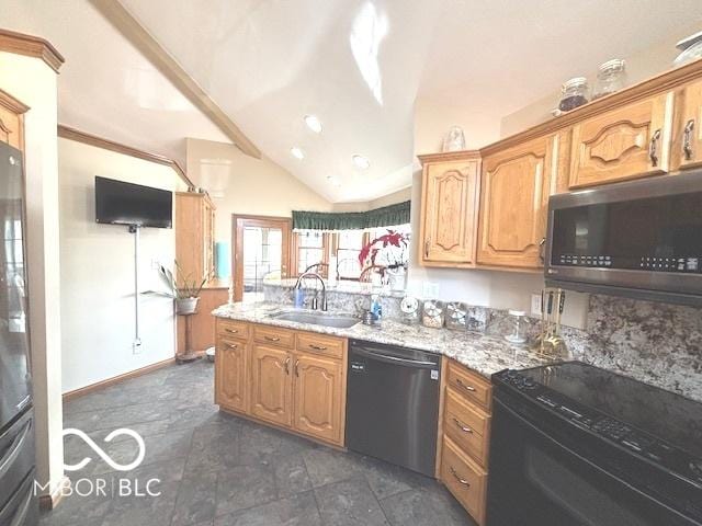 kitchen featuring vaulted ceiling, black dishwasher, sink, and light stone countertops