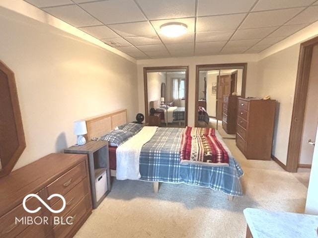 bedroom with a paneled ceiling