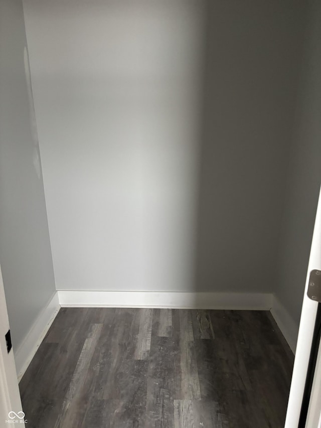 spare room with dark hardwood / wood-style floors