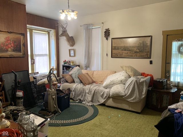 bedroom featuring carpet flooring and an inviting chandelier