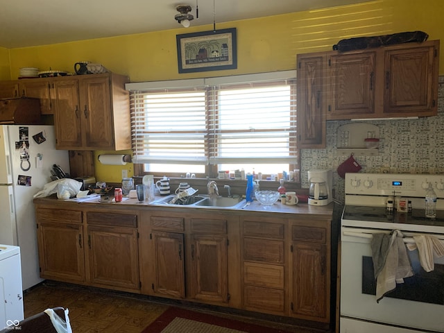 kitchen featuring sink and white appliances