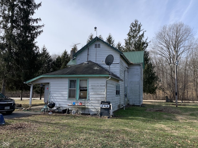 view of home's exterior featuring a yard