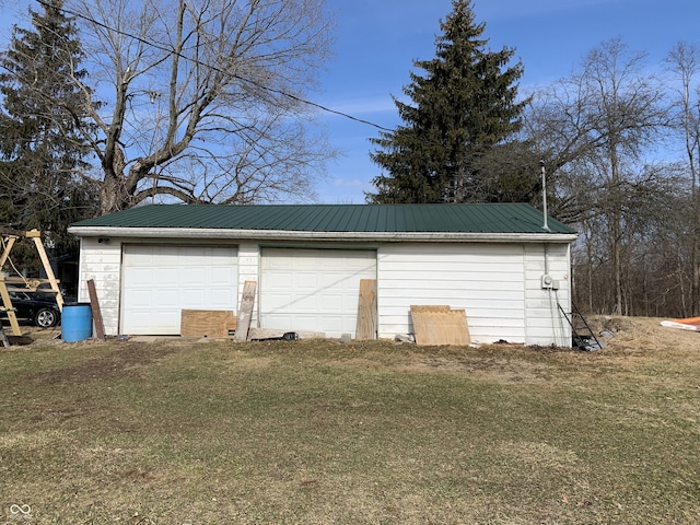 garage with a lawn