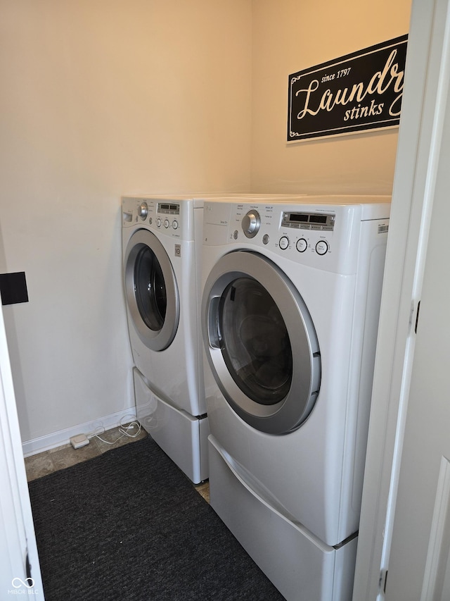 washroom with washer and dryer