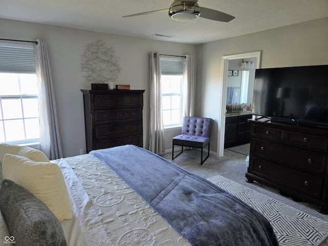 bedroom with light carpet and ceiling fan