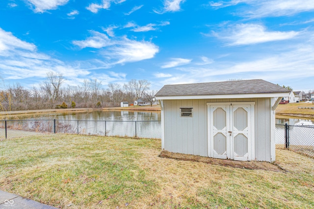 exterior space featuring a water view and a fenced backyard