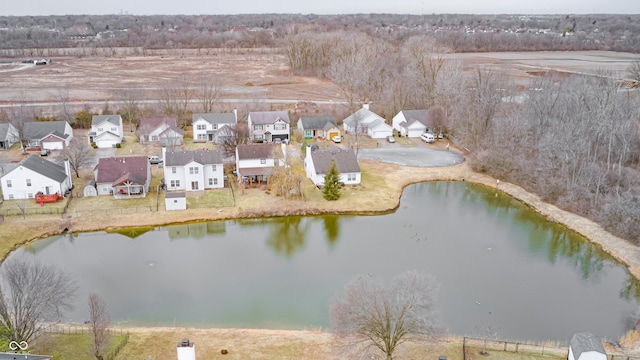 drone / aerial view with a water view and a residential view