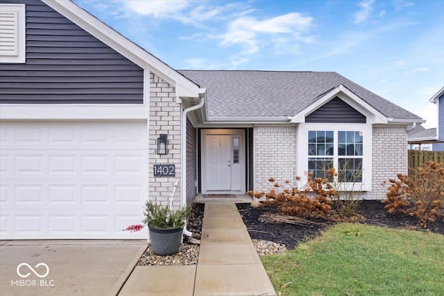 view of exterior entry featuring a garage