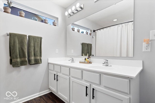 bathroom with vanity, hardwood / wood-style floors, and a shower with curtain