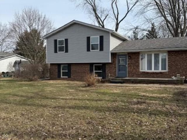 tri-level home with a front yard