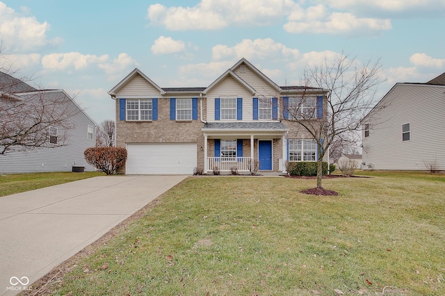 view of front of home featuring a porch, a garage, and a front yard