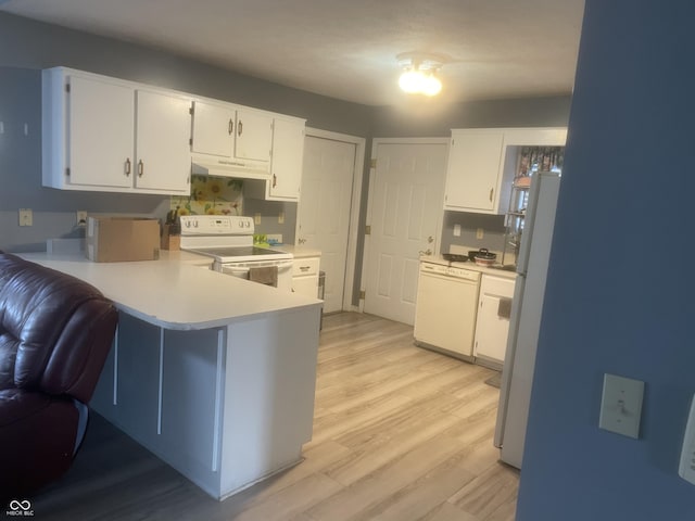 kitchen with white cabinetry, white appliances, kitchen peninsula, and light wood-type flooring