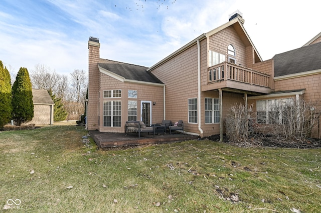 back of property with a yard and an outdoor hangout area