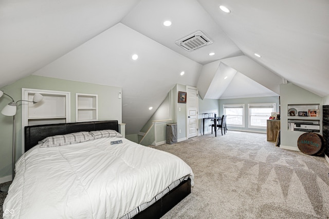 bedroom with carpet floors and vaulted ceiling