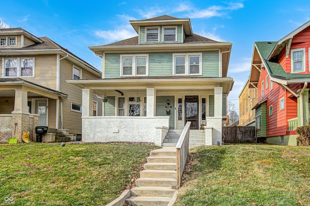 view of front facade with a porch and a front lawn