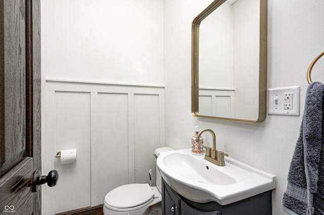 bathroom featuring vanity and toilet