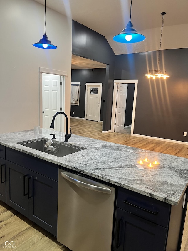 kitchen with sink, decorative light fixtures, stainless steel dishwasher, and light stone countertops