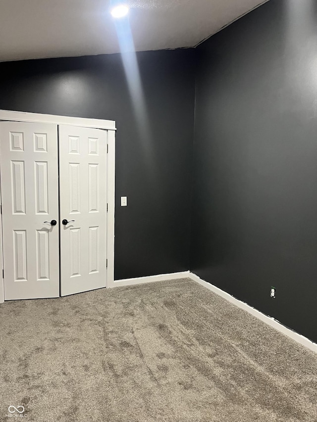 spare room featuring carpet flooring