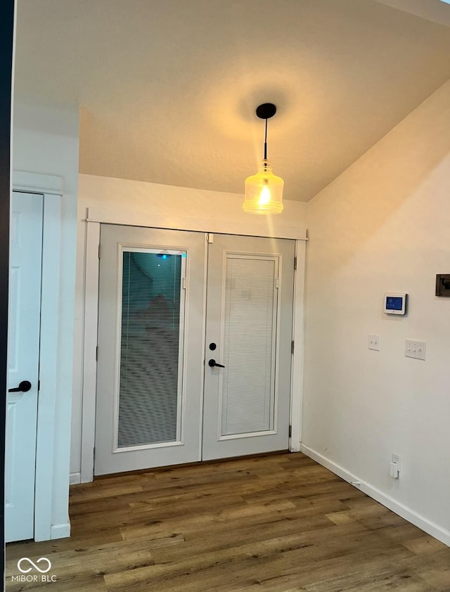 interior space with dark hardwood / wood-style flooring and french doors