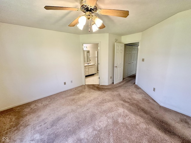 1348 Mccormicks Cir, Danville, IN 46122 - unfurnished bedroom featuring carpet, ensuite bathroom, baseboards, and a ceiling fan