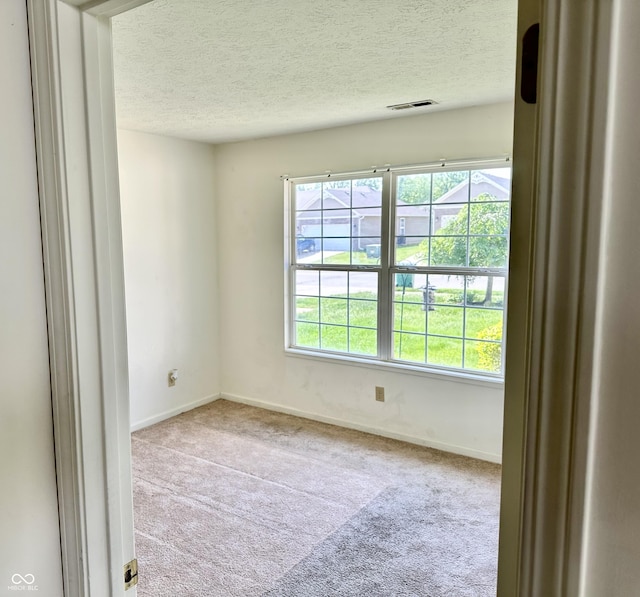 1348 Mccormicks Cir, Danville, IN 46122 - carpeted empty room featuring a textured ceiling and baseboards