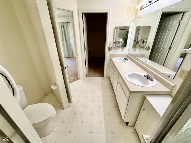 1348 Mccormicks Cir, Danville, IN 46122 - full bathroom with toilet, double vanity, tile patterned floors, and baseboards