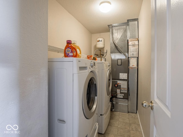 6264 Whitaker Farms Dr, Indianapolis, IN 46237 - laundry room with a textured ceiling and washer and clothes dryer