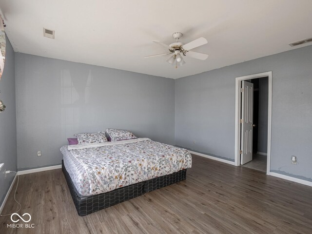 6264 Whitaker Farms Dr, Indianapolis, IN 46237 - bedroom with dark wood-type flooring and ceiling fan