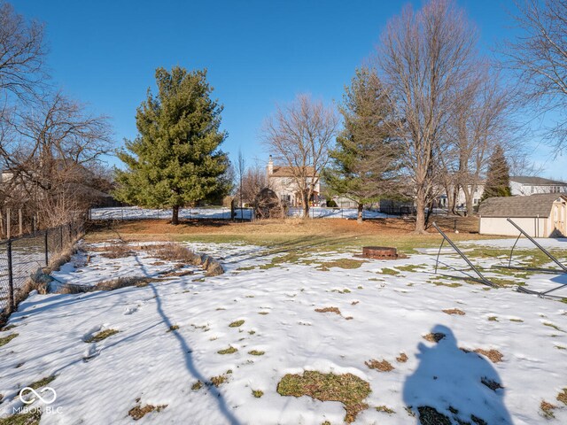 6264 Whitaker Farms Dr, Indianapolis, IN 46237 - snowy yard with an outdoor fire pit
