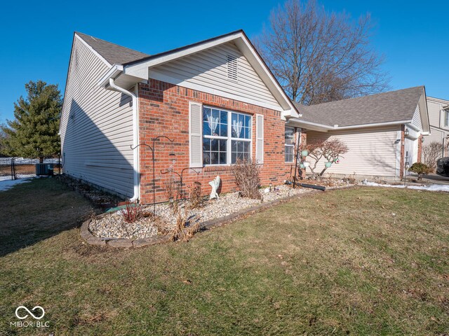 6264 Whitaker Farms Dr, Indianapolis, IN 46237 - view of front facade with a front yard and central AC unit