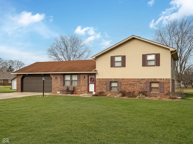 split level home with a garage and a front lawn