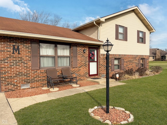 tri-level home with a front yard